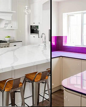Modern kitchen with LED backlit glass countertop and feature glass backsplash in purple glow