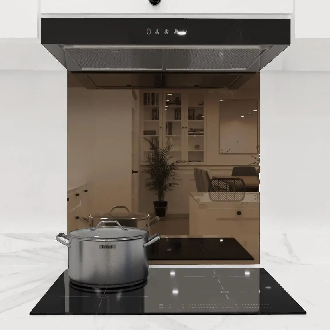 Bespoke glass kitchen splashback with mirrored finish, reflecting modern dining area and cookware