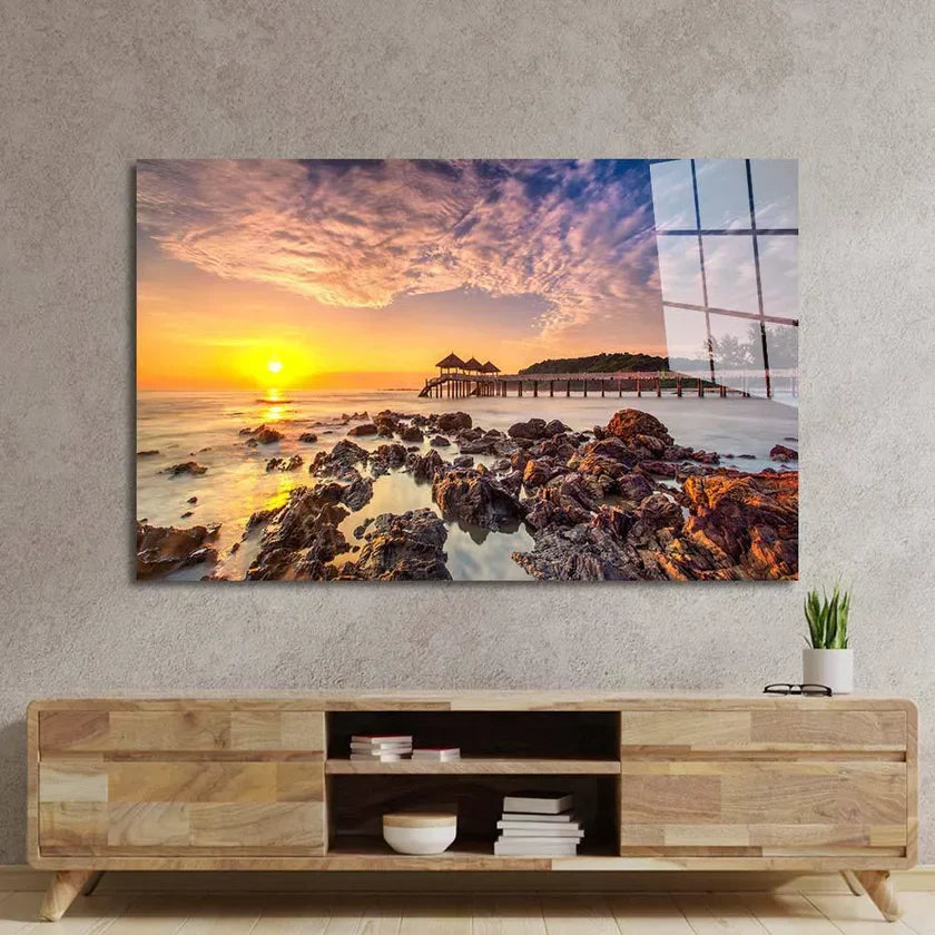 Bespoke decorative glass wall art featuring sunset over rocky beach, perfect for luxury residential interiors