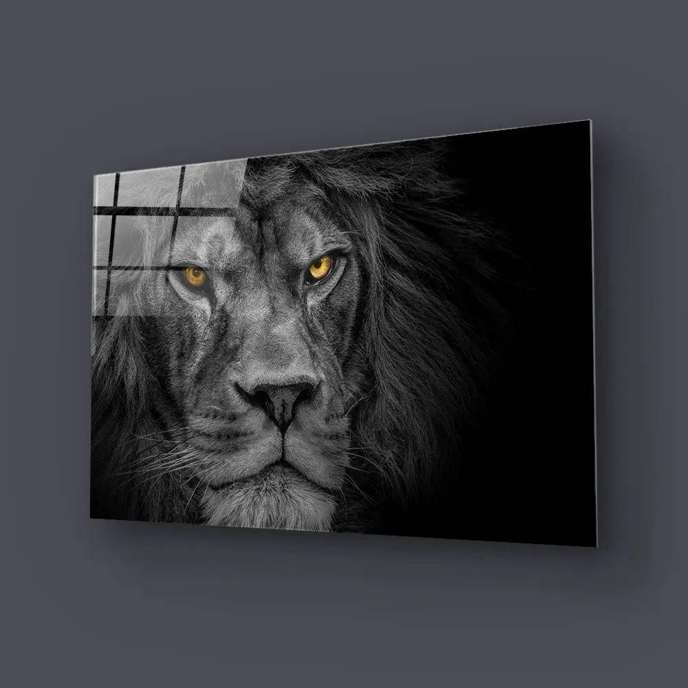 Bespoke glass art featuring a lion's face with striking yellow eyes, ideal for luxury interiors.