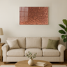 Modern living room with beige sofa, round wooden coffee table, green plant, and copper glitter wall art