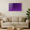 Modern living room with beige sofa, wood coffee table, green plant, and purple glitter wall art