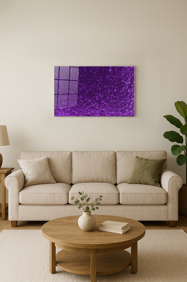 Modern living room with beige sofa, wood coffee table, green plant, and purple glitter wall art