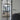 Modern interior with black metal-framed glass double hinged door and cozy living room