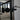 Close-up of black metal double hinged door handle with frame in modern living room