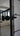 Close-up of black metal double hinged door handle with frame in modern living room