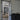 Modern interior with double hinged glass door with black metal frame separating living spaces