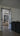Modern interior with double hinged glass door with black metal frame separating living spaces
