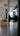 Close-up of matte black iron door handle on glass double hinged door in modern living room