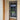 Modern black framed glass hinged door installed indoors, next to wooden door and beige walls