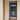 Modern black framed glass hinged door installed indoors, next to wooden door and beige walls
