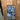 Double hinged black metal frame glass door with modern living room and chandelier view