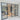 Modern black metal frame double door with glass side panels in a bright interior room