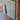Interior view of a modern home with a glass double hinged door and wooden herringbone floor