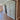 Interior view of a modern home with a glass double hinged door and wooden herringbone floor