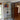 Black metal framed double door with glass side panels in modern living room
