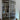 double hinged glass door with silver frame in modern interior with wooden chair