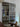 double hinged glass door with silver frame in modern interior with wooden chair