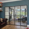 Modern black framed double glass door with two side panels in living room with blue wall and wooden floor