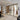 Modern interior with black framed double glass doors and side panels separating rooms