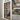 Interior black-framed double hinged glass door next to a bookshelf with books and miscellaneous items