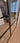 Double hinged black metal frame glass door with modern handle in a stylish living room