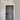 Modern black hinged interior door with frame in white hallway with marble patterned floor and geometric light fixture