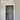 Modern black hinged interior door with frame in white hallway with marble patterned floor and geometric light fixture