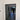 Modern double hinged black framed glass door with grid pattern, white walls, marble floor with patterned border