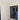 Modern double hinged glass door with black frame in bright room with marble floor