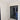 Modern double hinged glass door with black frame in bright room with marble floor