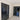 Interior hallway with double hinged black framed glass doors and marble floor with decorative border