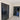 Interior hallway with double hinged black framed glass doors and marble floor with decorative border