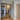 Modern double hinged black metal frame glass interior door with herringbone wood floor