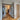 Modern interior with black framed glass double hinged doors and wooden herringbone floor