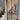 Double hinged glass door with brown metal frame in modern interior under construction