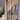 Double hinged glass door with brown metal frame in modern interior under construction