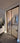 Double hinged glass door with brown metal frame in modern interior under construction