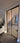 Double hinged glass door with brown metal frame in modern interior under construction