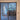 Double hinged glass door with wooden frame in modern unfinished interior
