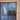 Double hinged glass door with wooden frame in modern unfinished interior