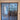 Double hinged glass door with dark metal frame and wooden handles in modern interior