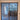 Double hinged glass door with dark metal frame and wooden handles in modern interior