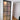 Modern hinged frosted glass door with black metal frame and wooden floor in minimal interior