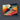Abstract geometric glass art panel with vibrant orange, teal and gold hues for modern interior decor