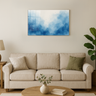Modern living room with beige sofa, wooden round coffee table, abstract blue watercolor wall art