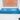 Blue fine sparkle glass splashback under kitchen window on white speckled countertop