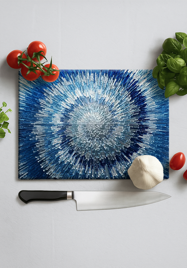 Blue spiral printed chopping board with chef knife, garlic, basil, cherry tomatoes on white surface