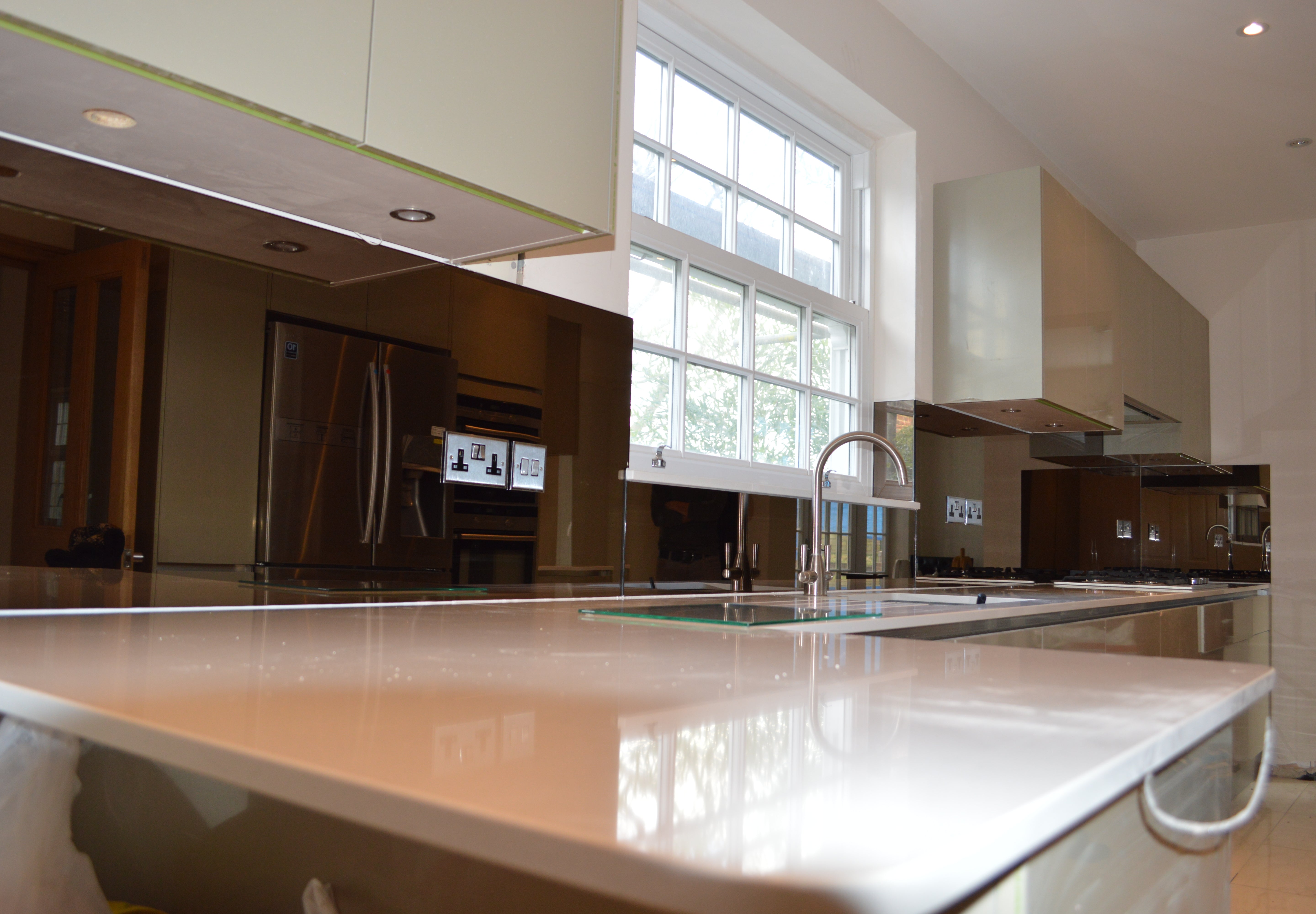 Bespoke kitchen glass splashback installed in a modern London kitchen