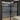 Double hinged black framed glass doors with frosted middle panels in modern interior